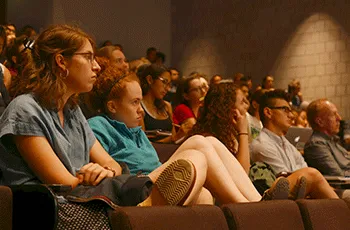 Students sit in an auditorium