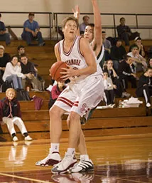 Ian mccormick with basketball being guarded