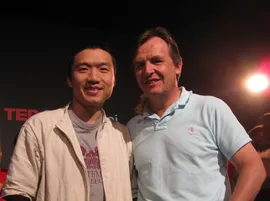 Feng He '03 (left) with TED chief curator Chris Anderson