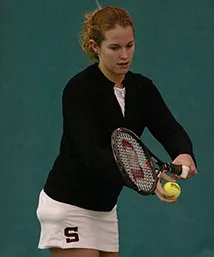 Sonya Reynolds prepares tennis serve