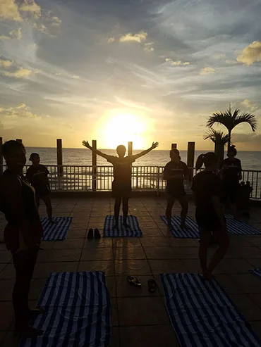Women's basketball team practices yoga