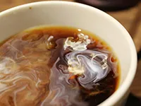 Milk swirling in a coffee cup