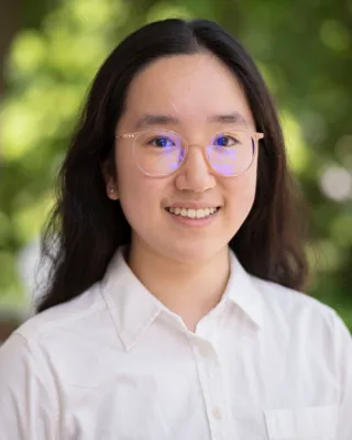 Xinyun looks at the camera