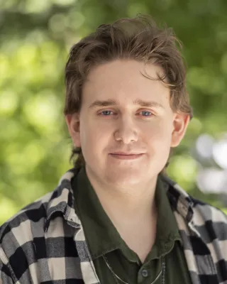 Bradley smiles at the camera.