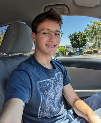 James Lewis seated in a car