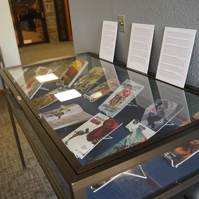 Books from Zuri's collection on exhibition in display cases in McCabe Library 