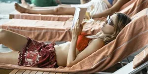 woman reading at the beach