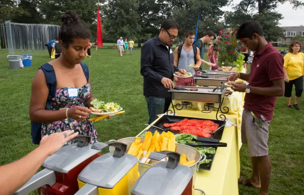 Students serving themselves at an outdoors Dining Services event