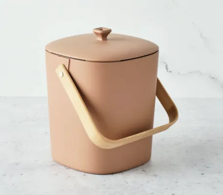 This image depicts a tan colored bucket with a handle and a lid on a white background