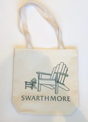 This image depicts a white tote bag with a drawing of two Adirondack chairs, one large and one small, above the word "Swarthmore", all in black ink