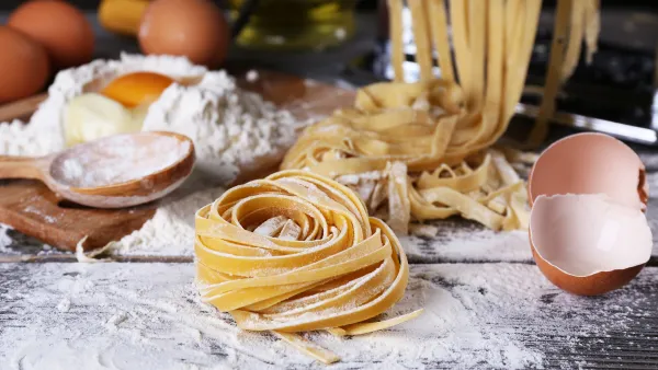 pasta dough on a table with flour