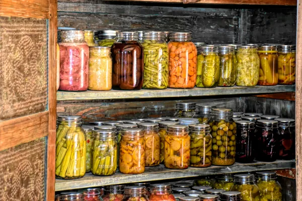 cans of fruit and veggies in a pantry