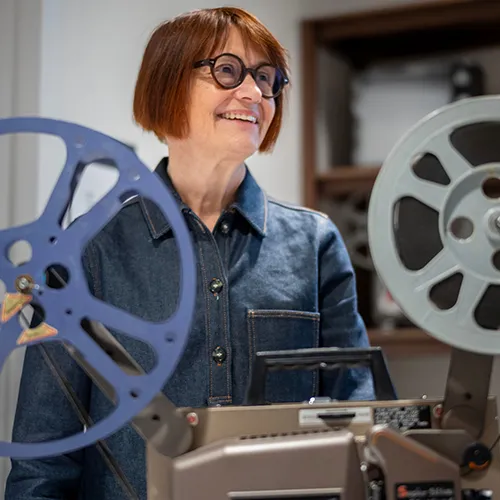 patty white with film projector