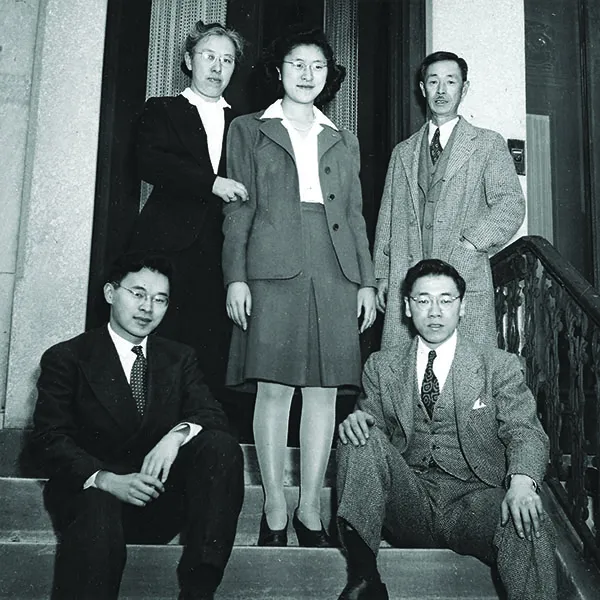 black and white old photo of Japanese men and women 