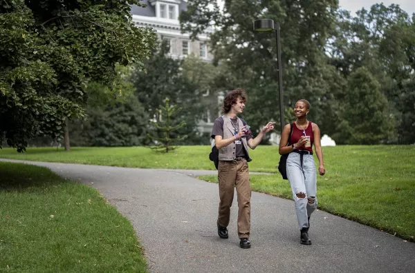 two students walking on campus