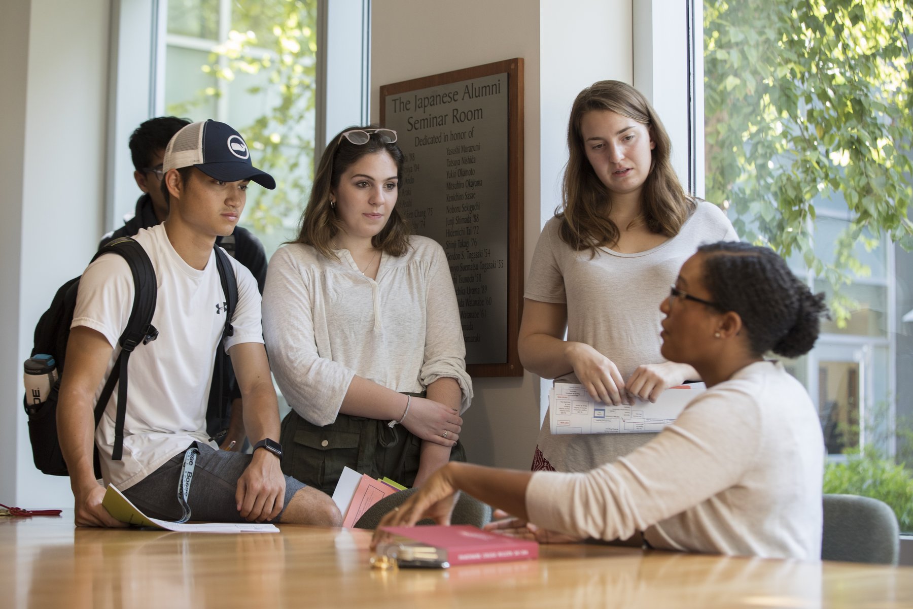 professor advising a small group of students