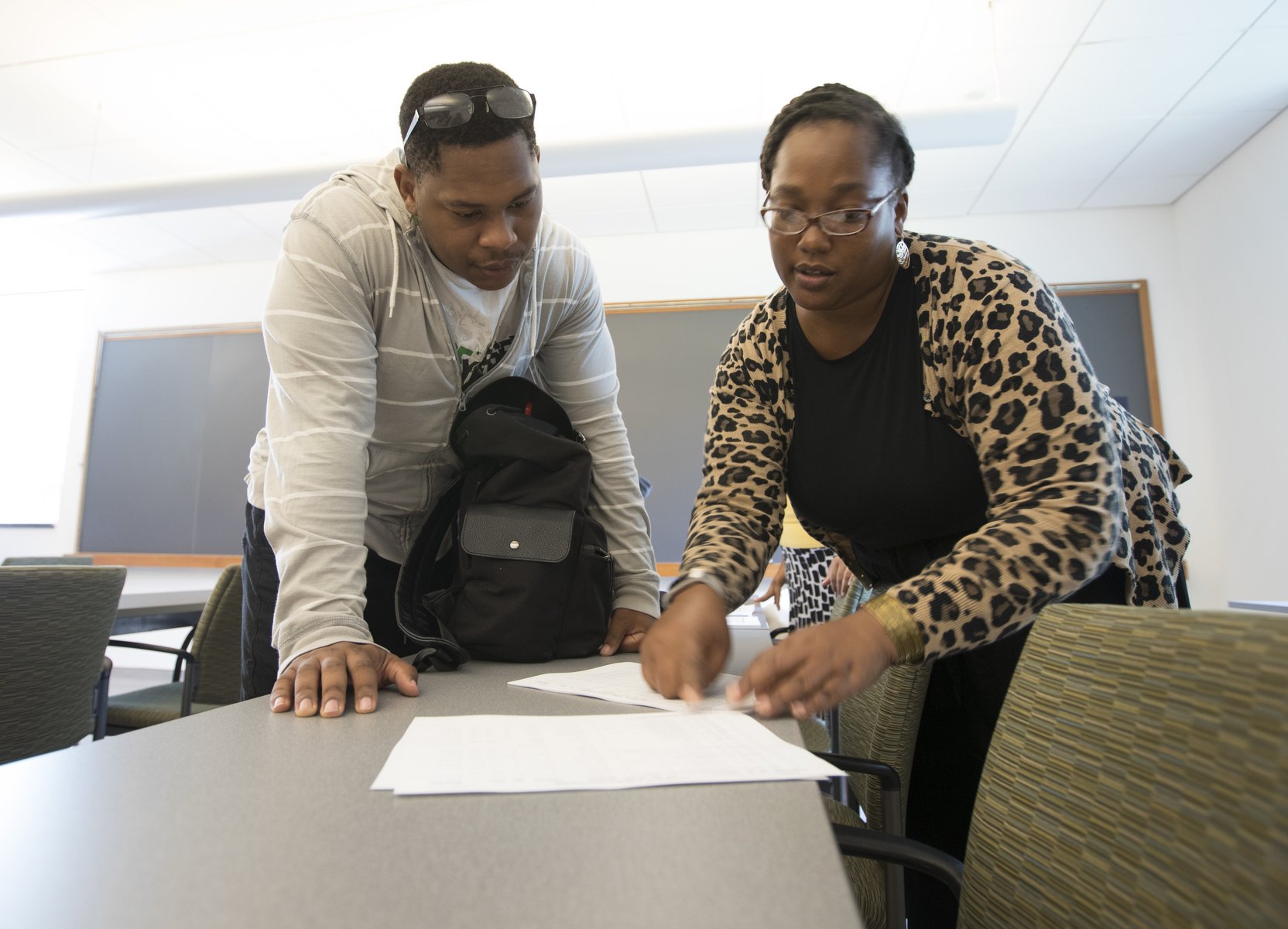student and academic advisor reviewing a course plan