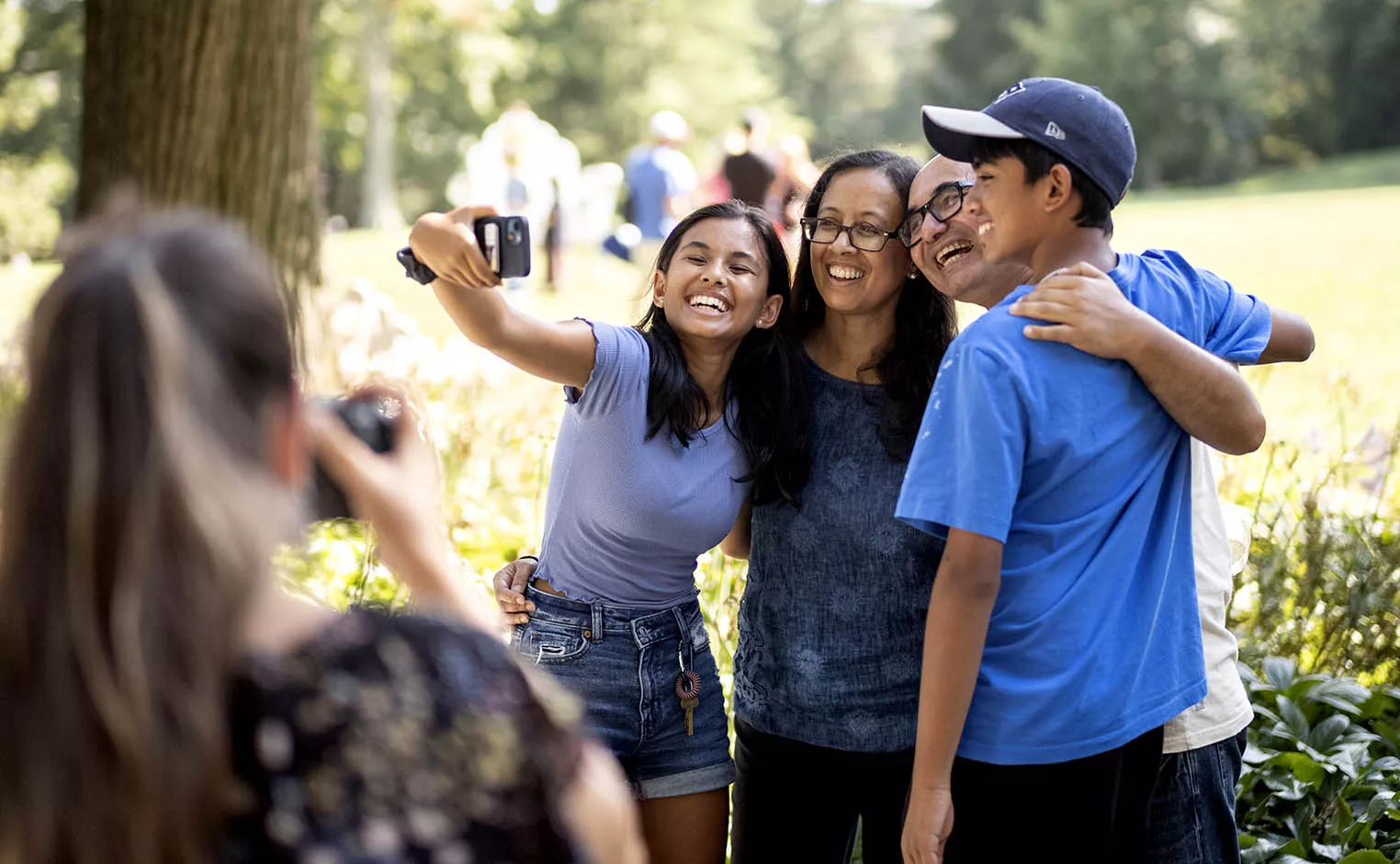 Visiting parents and student taking a selfie