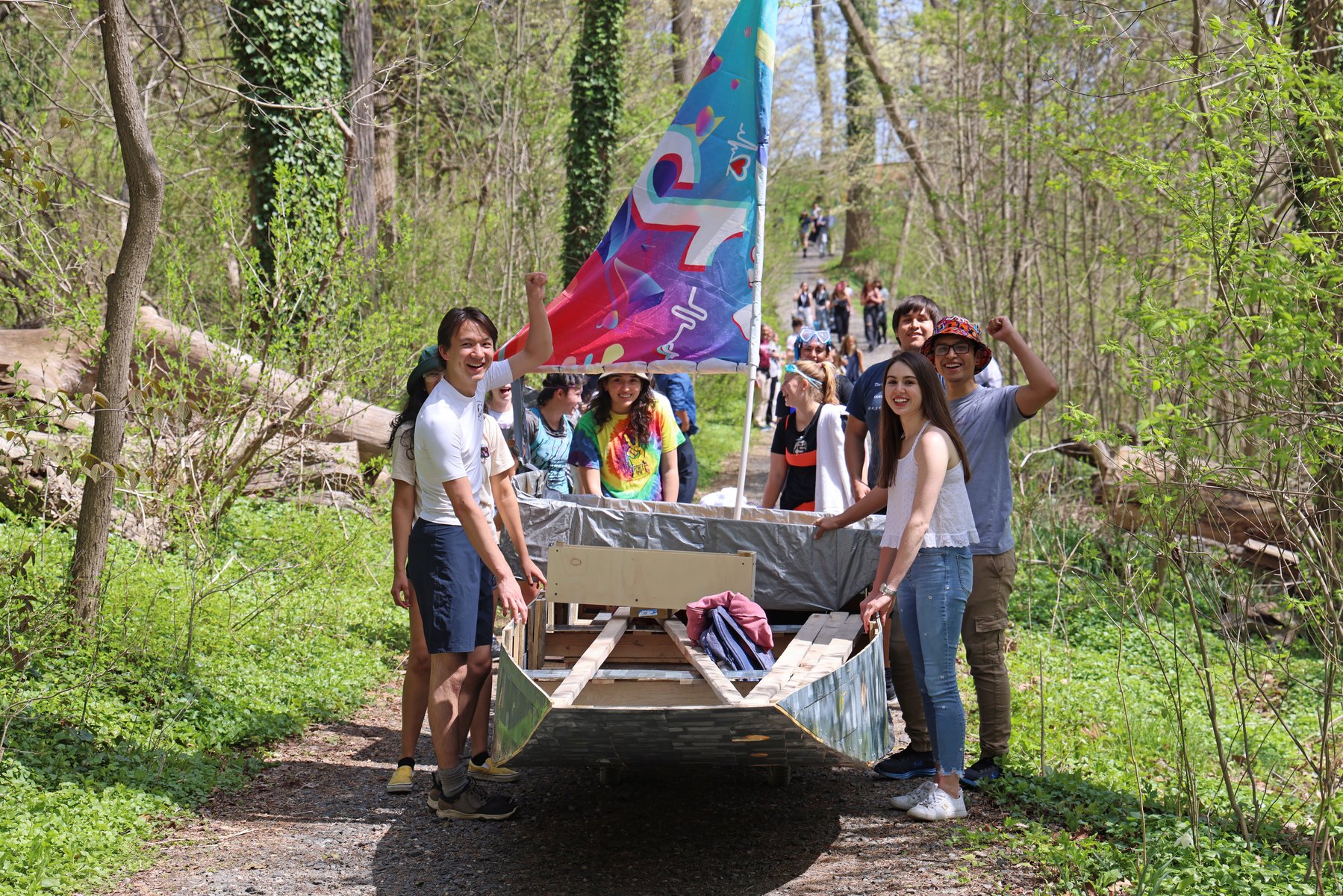 A group of Swarthmore students carry their boat in preparation to enter in the Crum Regatta, one of Swarthmore's many campus traditions.