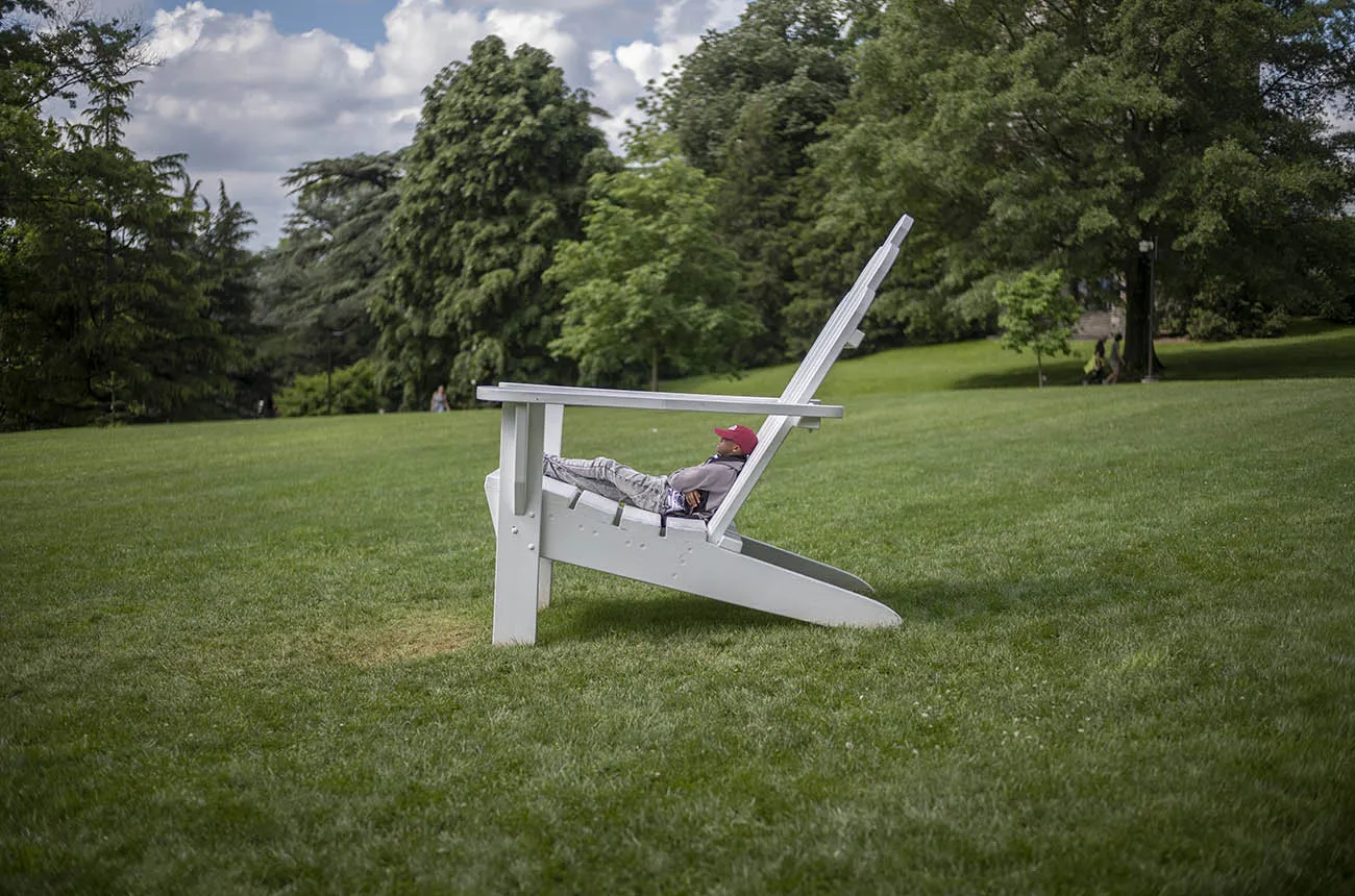alumni sitting on big chair