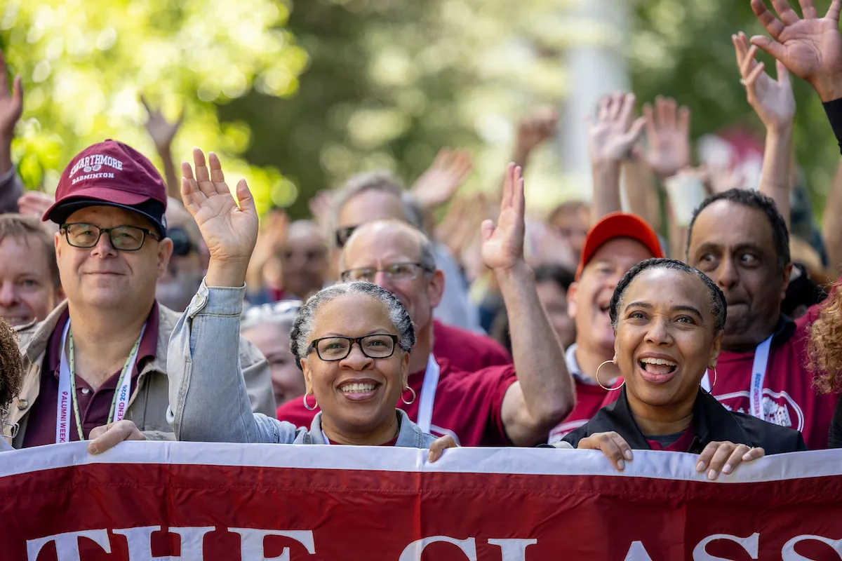 Alumni wave and cheer during the annual Parade of Classes 