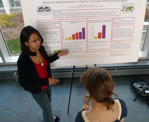 student presenting honors research poster