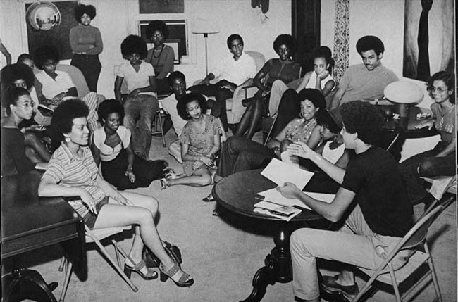 black and white photo of students talking from 1973