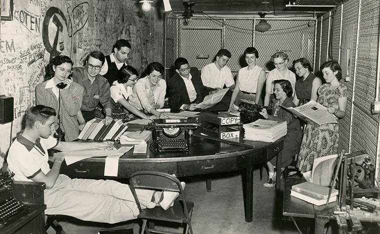 Phoenix staff at work around a table circa 1940s