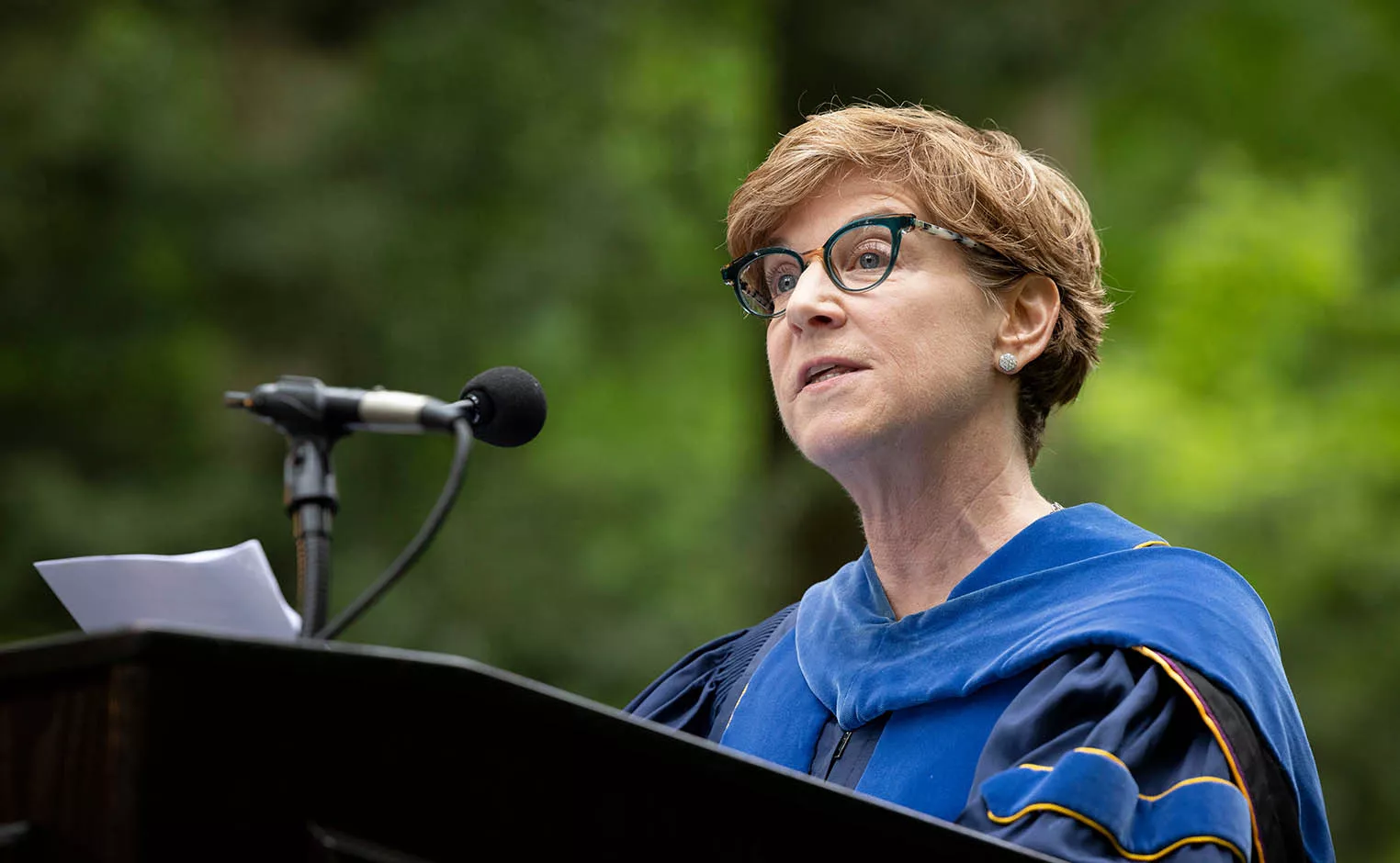 Patricia Reilly speaking at podium