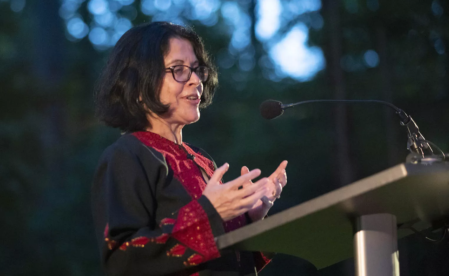 Farha Ghannam  speaking at podium