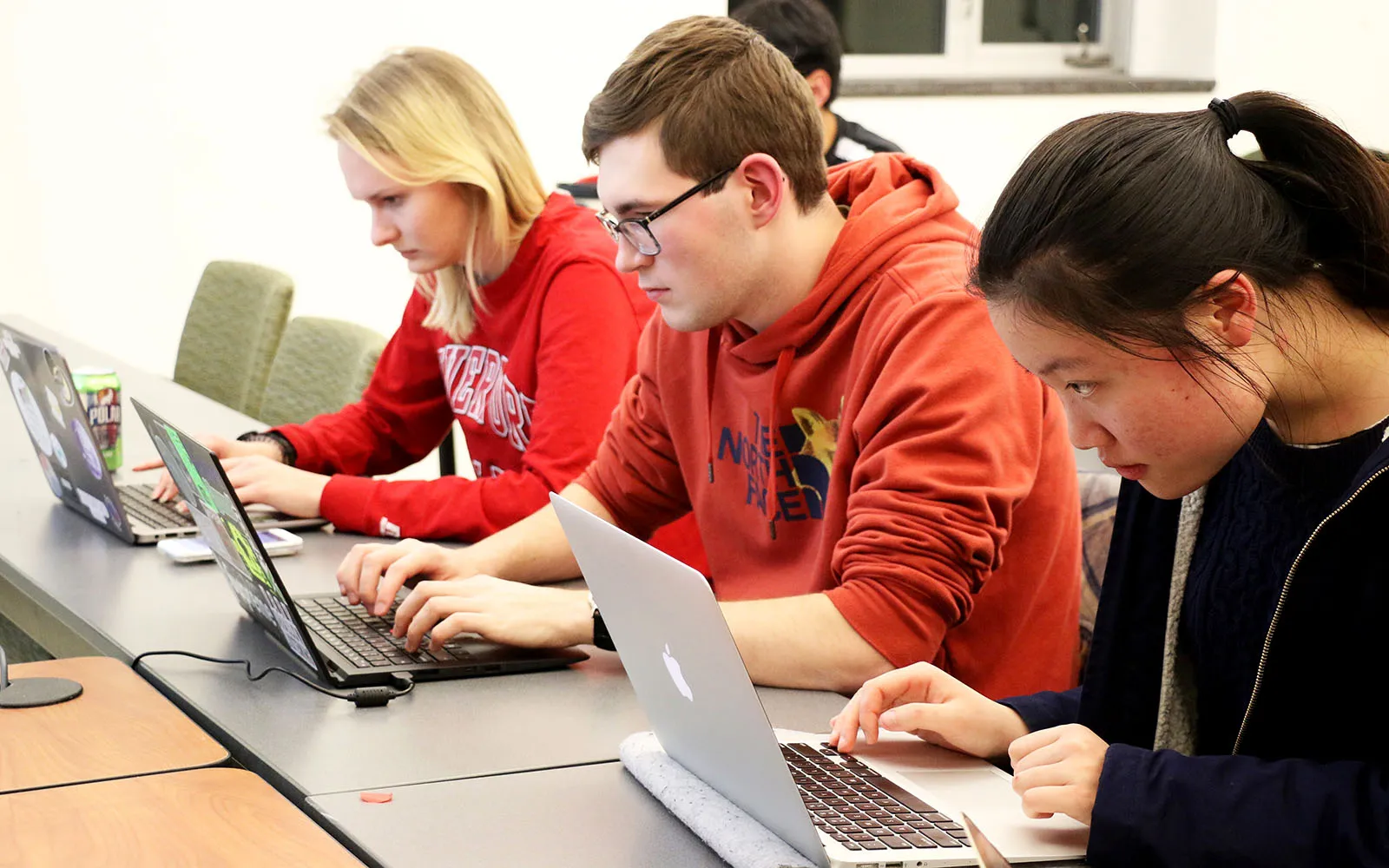 students using laptops in a computer programming compeitition