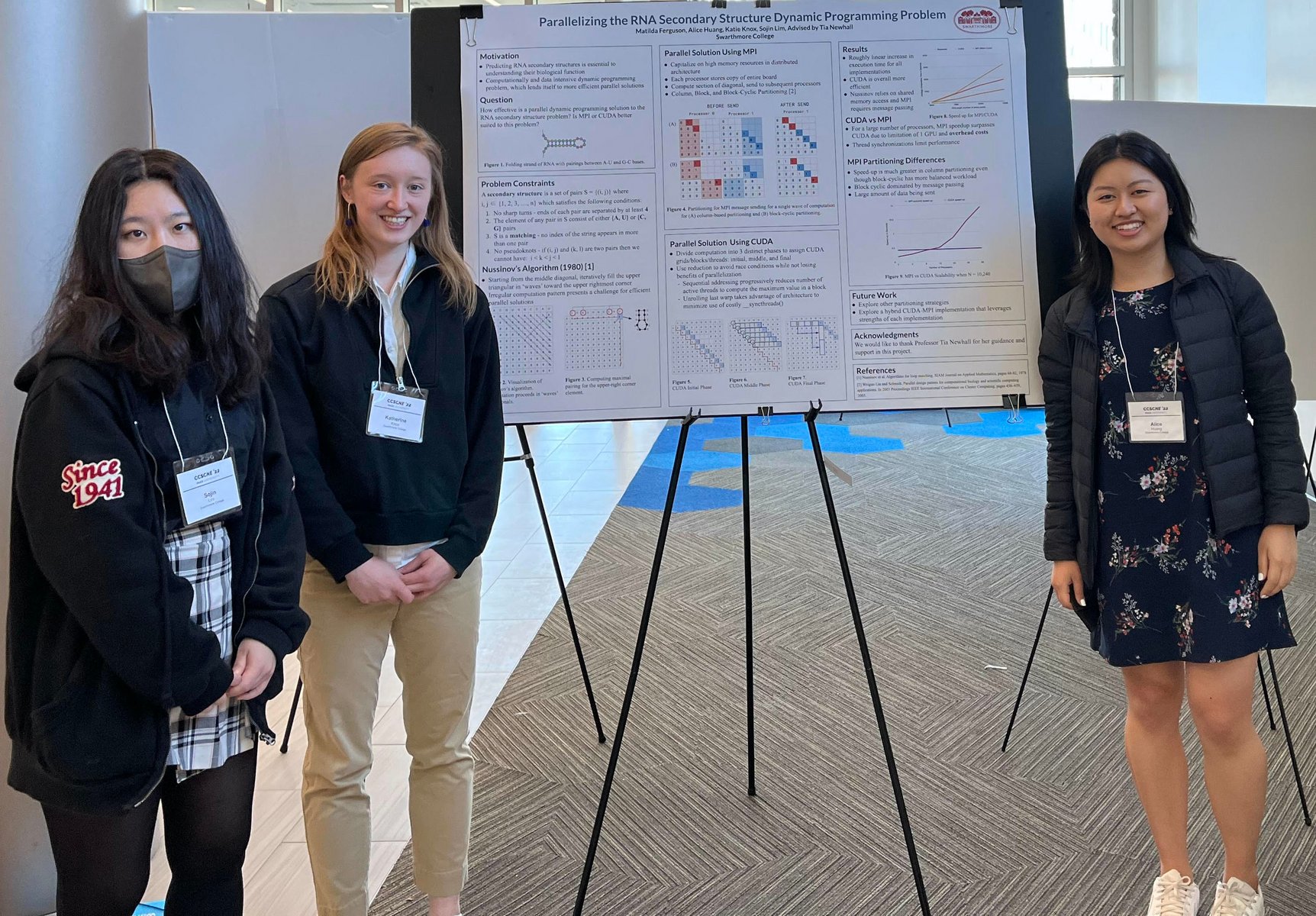comp sci students with research poster
