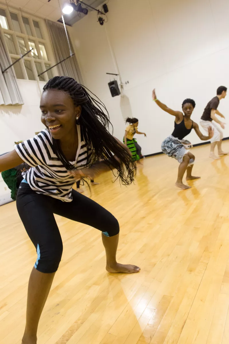 dancers in rehearse African steps