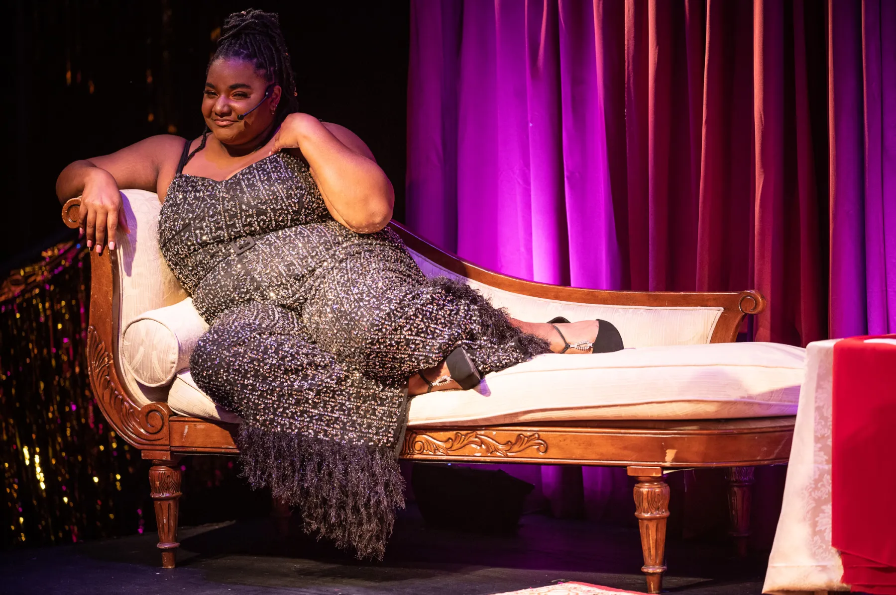 Marie Inniss lying on a couch