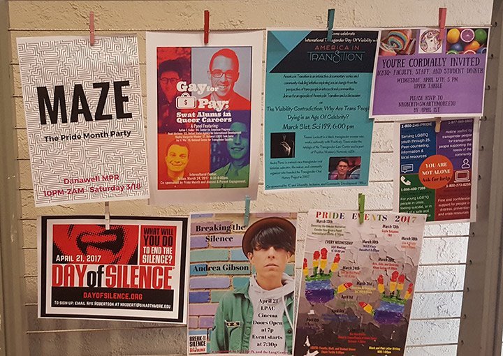 LGBTQ event posters on bulletin board