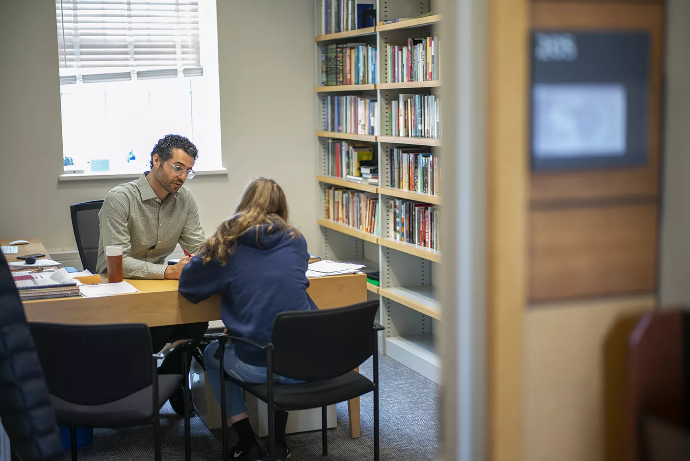 Professor Shokr advises a student during office hours.
