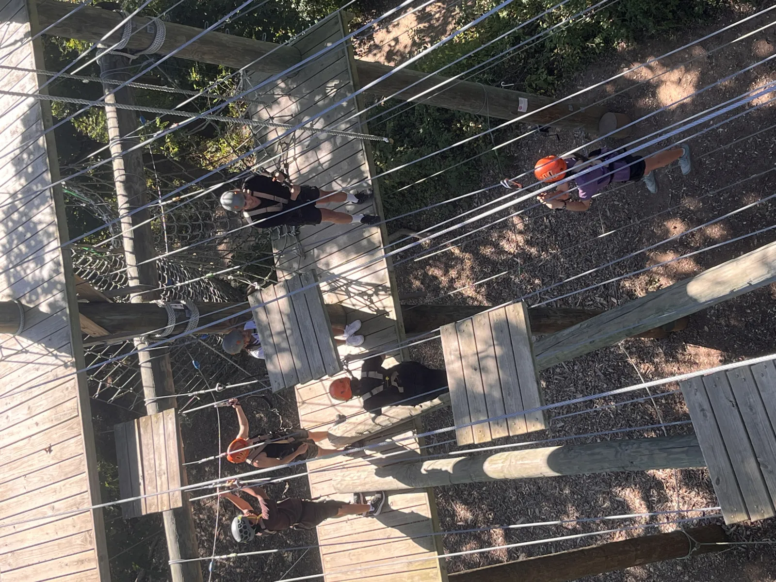 Student leaders performing a rope challenge.