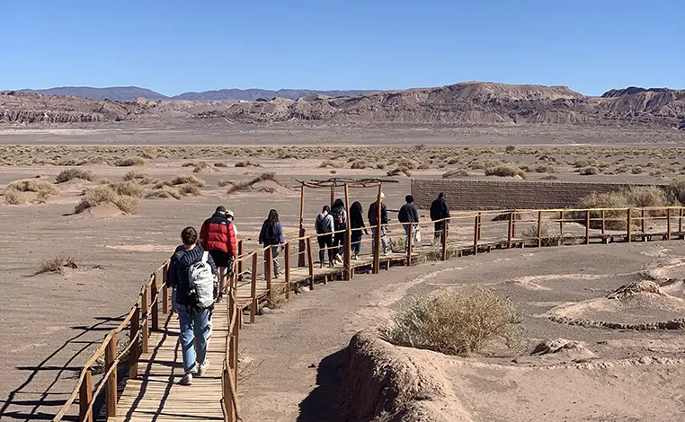 students walk single file along a path in Chile 