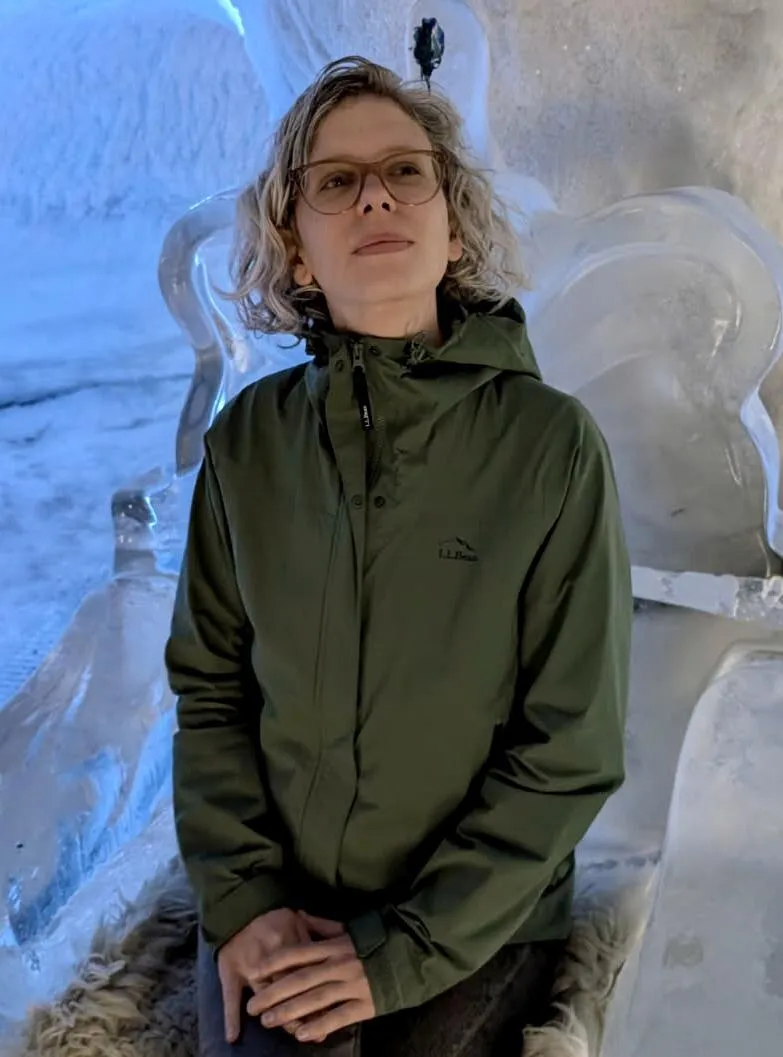 Liz Waltman sitting on a chair made of ice in Iceland