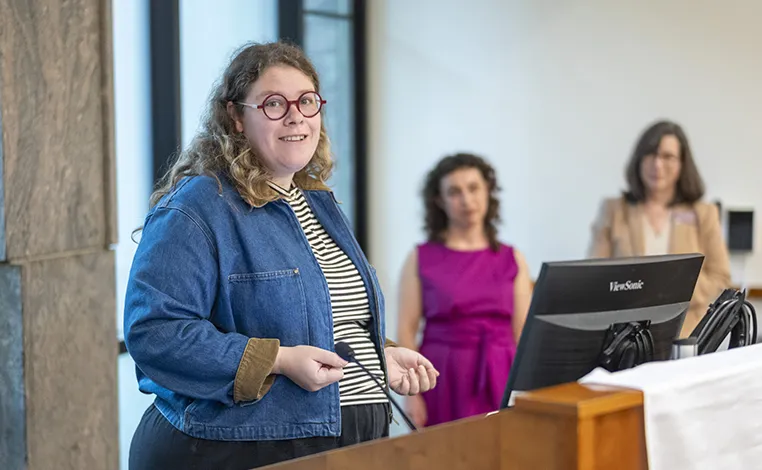 Prof. Sophia Berinstein speaks at an event celebrating faculty publishing