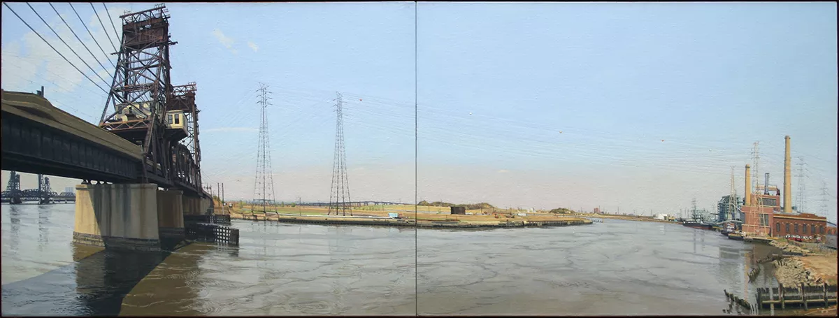 Wideframe shot of bridge over river in industrial area