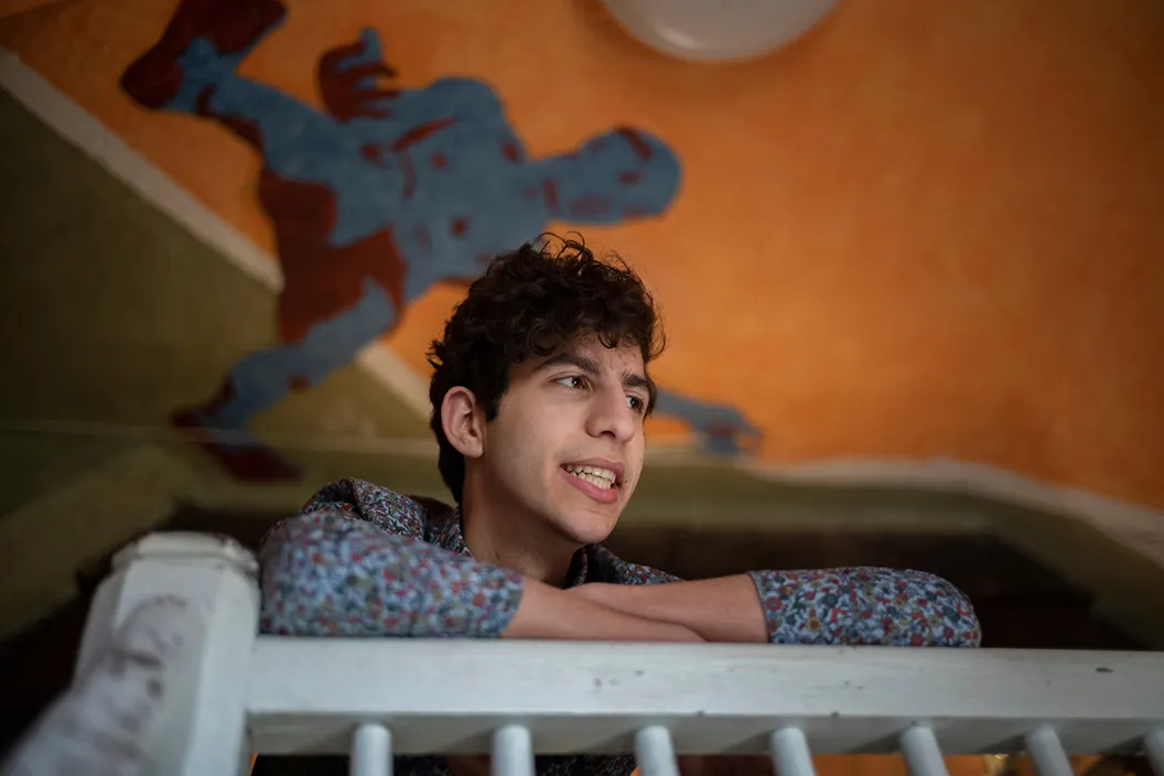Fouad Dakwar '22 rests arms on railing of balcony