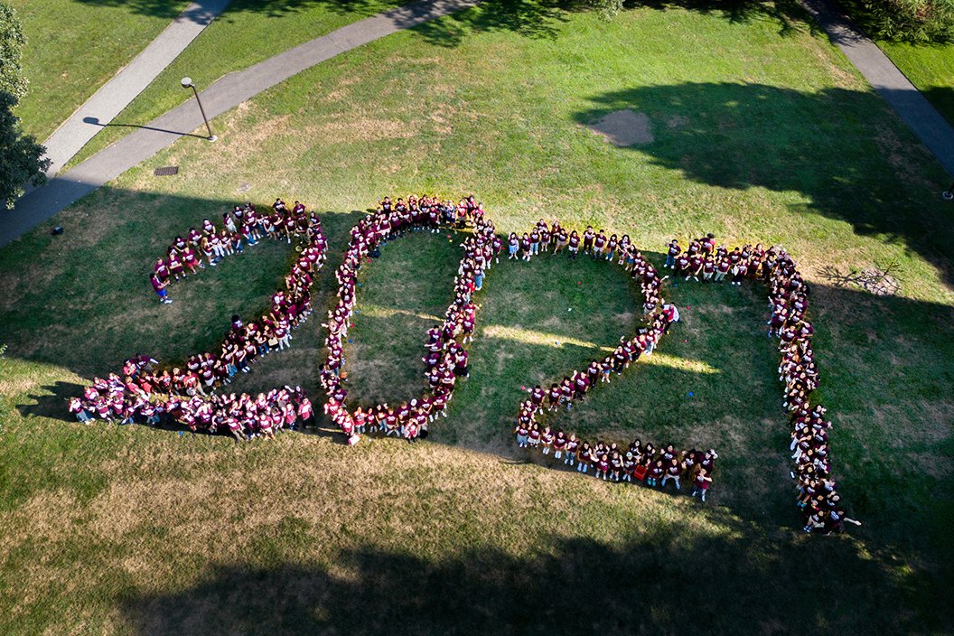 Class of 2027 members spell out large "2027" with bodies