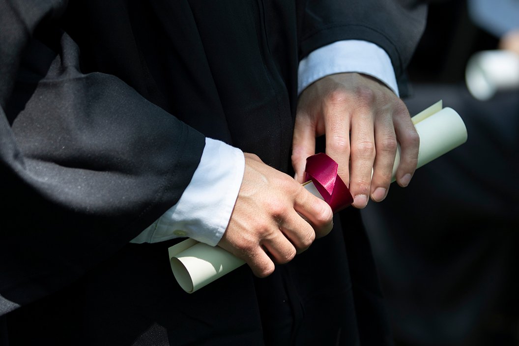 Hands hold diploma