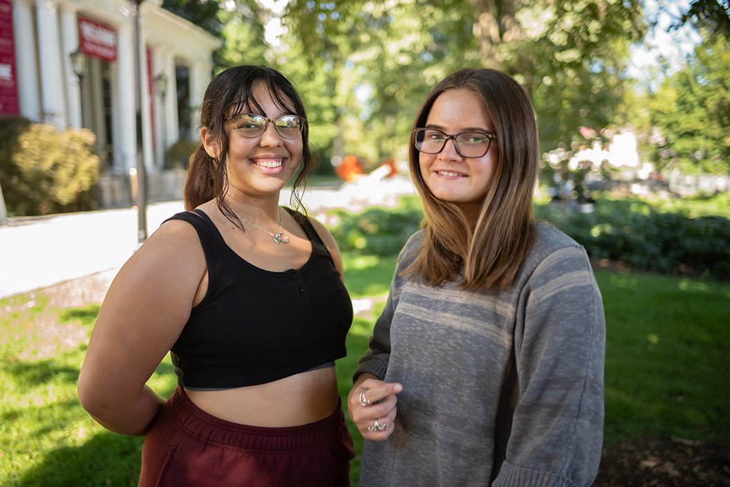 Melody Herrera-Garcia ’26 (left) and Danika Grieser ’26 on Parrish lawn