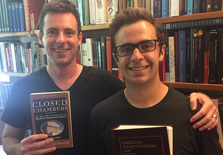 Noah Giansiracusa and Cameron Ricciardi pose with law books