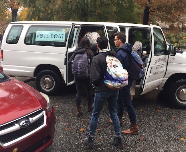 Students get into van to go to polls