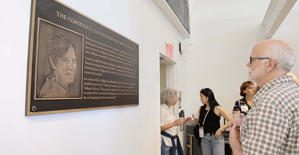 Person examines plaque dedicated in honor of Connie Hungerford