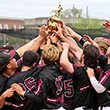 Baseball team holds conference trophy