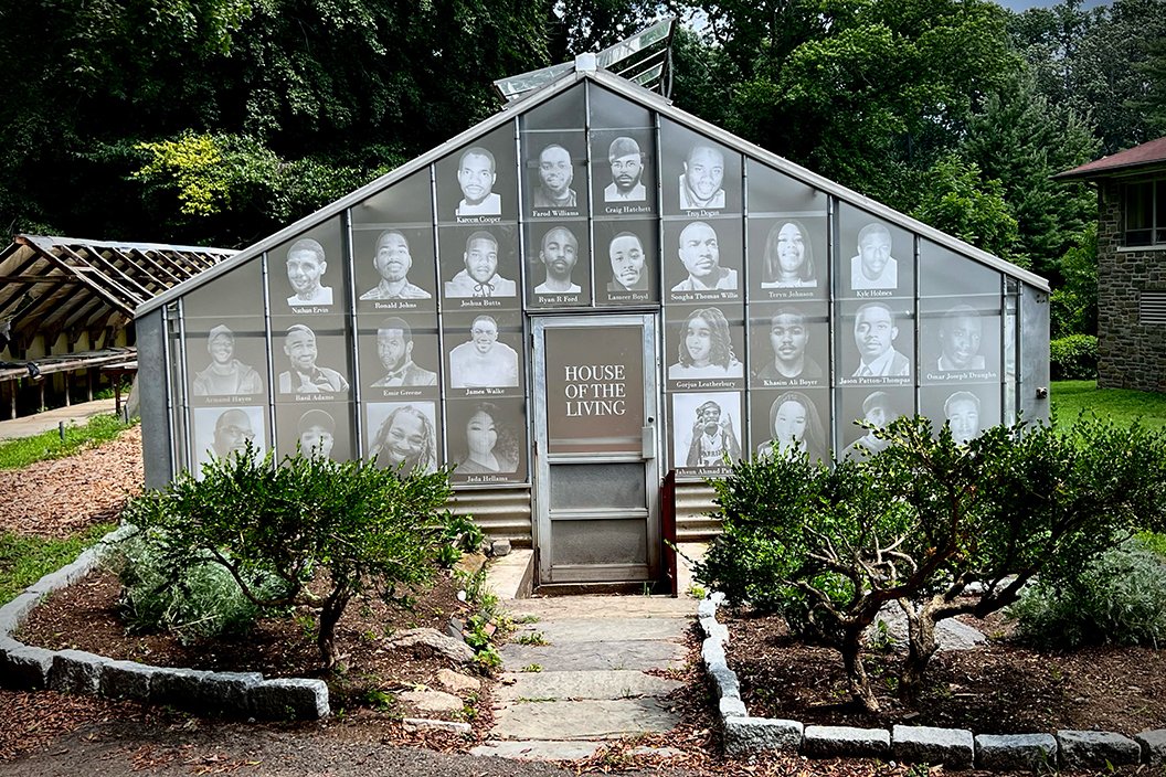 Greenhouse with images of homicide victims in window panes